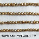 3167 side drilled pearl 4-4.5mm gold.jpg